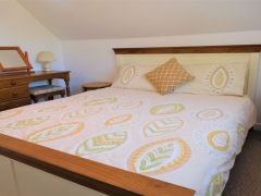 Kingsize bed with room for a cot